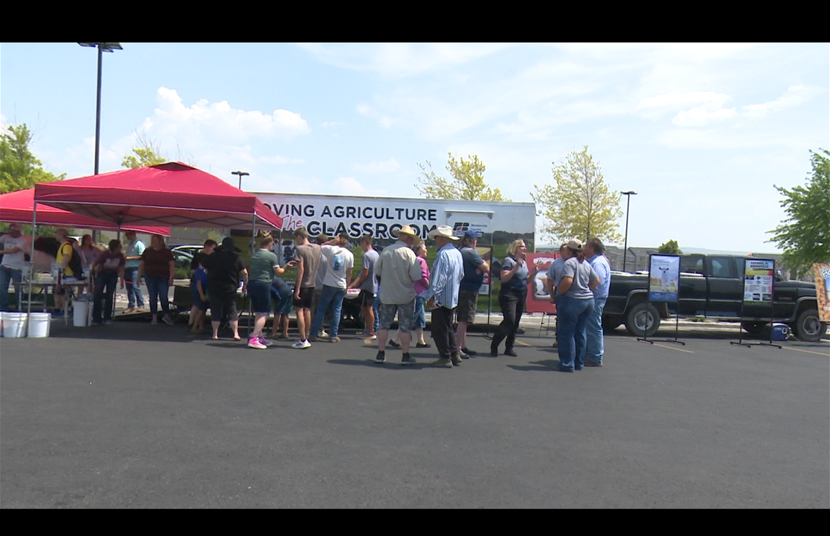 People visit an education booth for Thank a Farmer Day at Culver's restaurant in Ammon. 